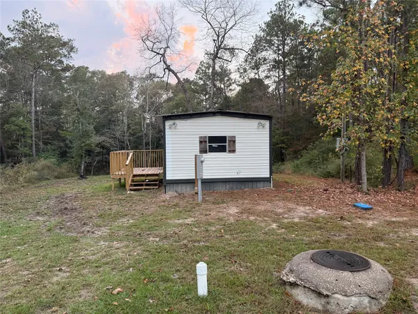 a house view with a backyard space
