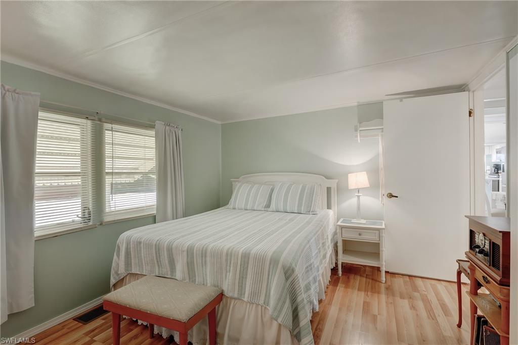 104 Willow Lane, Unit 30 Naples, FL 34114 - Photo 11 of 27 a bedroom with a bed and a window