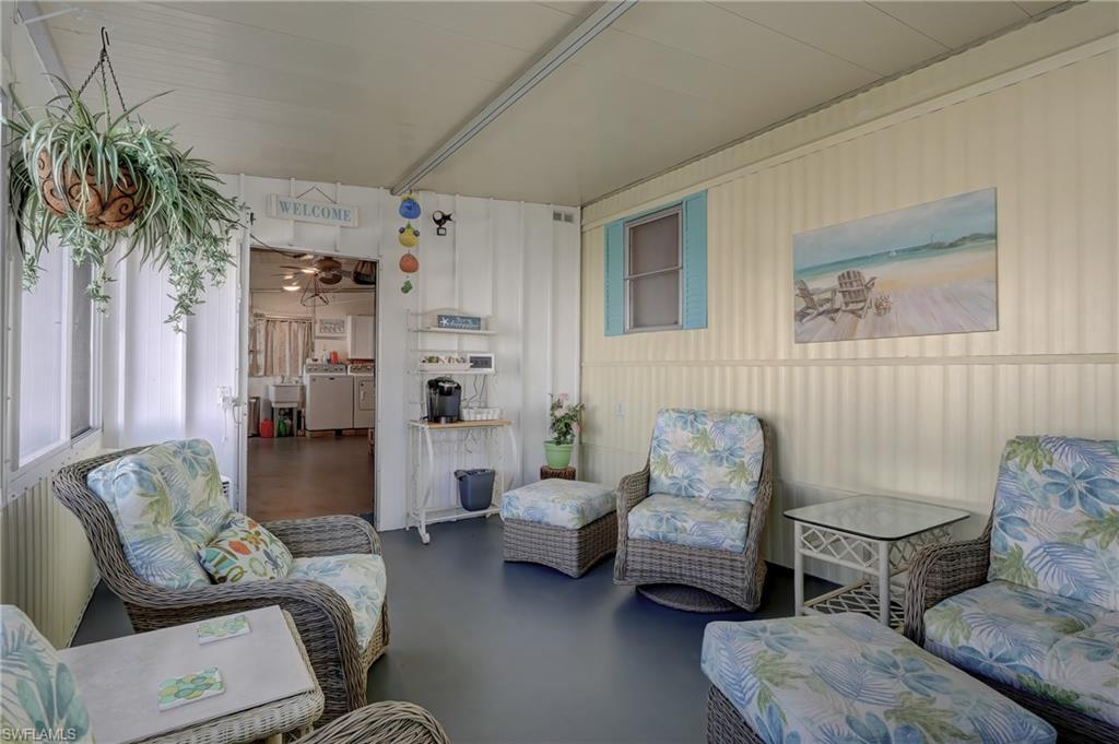 104 Willow Lane, Unit 30 Naples, FL 34114 - Photo 16 of 27 a living room with furniture and a couch