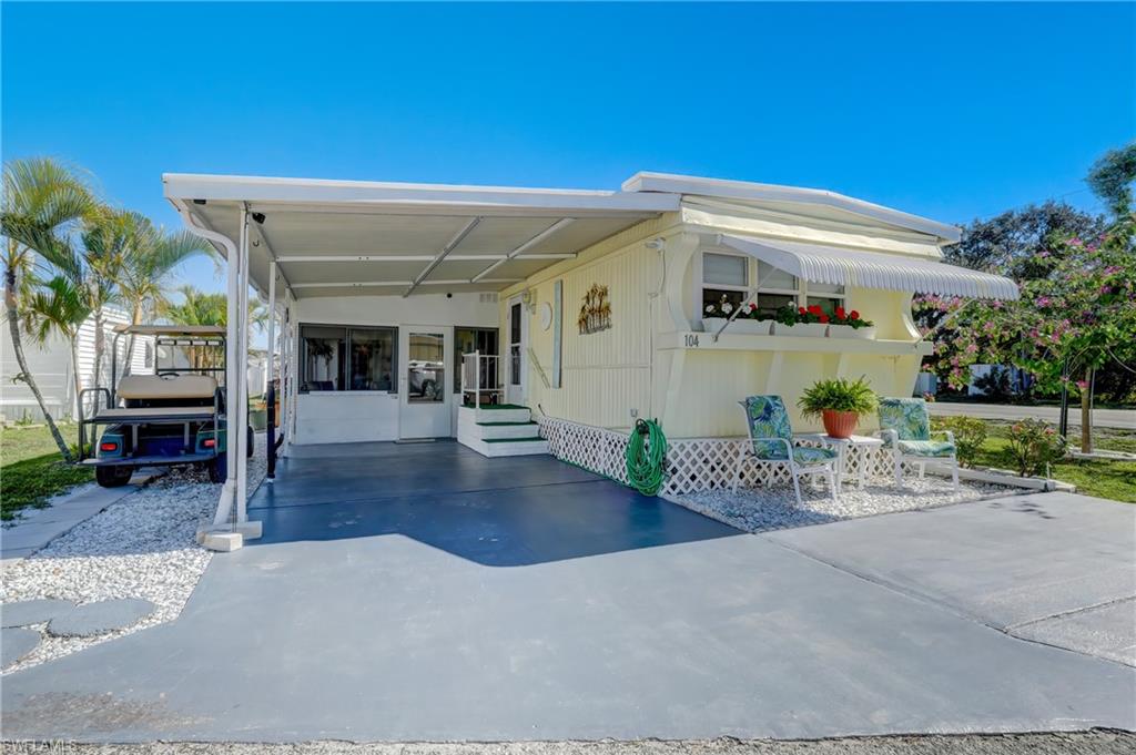 104 Willow Lane, Unit 30 Naples, FL 34114 - Photo 17 of 27 a view of a porch with seating space