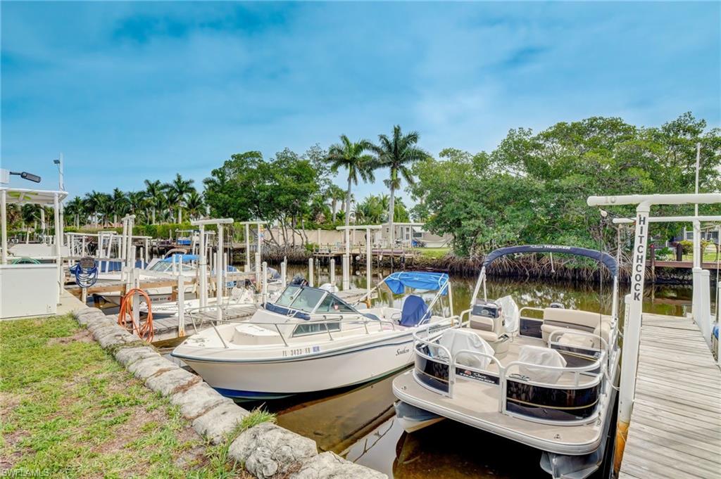 104 Willow Lane, Unit 30 Naples, FL 34114 - Photo 19 of 27 a view of a swimming pool with chairs