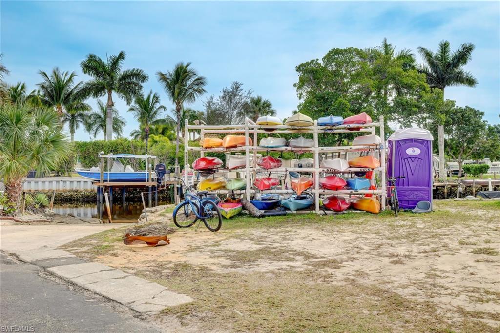 104 Willow Lane, Unit 30 Naples, FL 34114 - Photo 21 of 27 a view of a filled with furniture and a car park