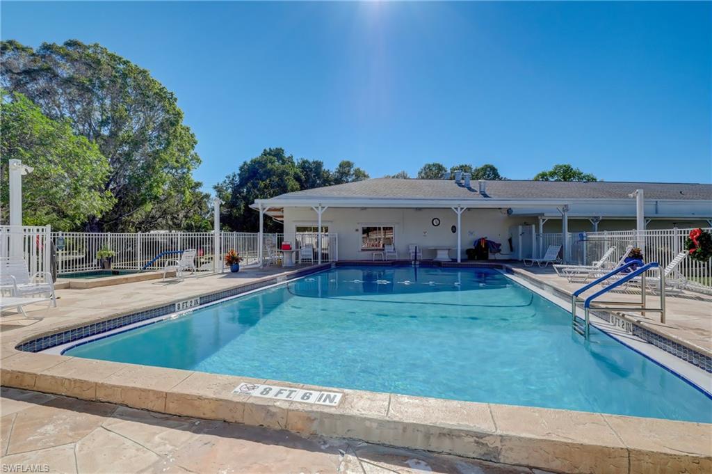 104 Willow Lane, Unit 30 Naples, FL 34114 - Photo 25 of 27 a view of a house with backyard and sitting area