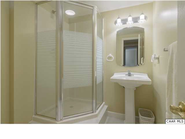 4284 Slam Gate Road Crozet, VA 22932 - Photo 18 of 30 a bathroom with a sink a mirror a shower and a mirror