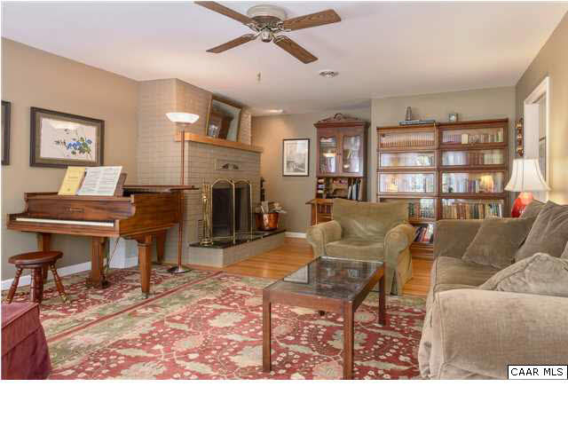 4284 Slam Gate Road Crozet, VA 22932 - Photo 2 of 30 a living room with furniture a dining table and a piano