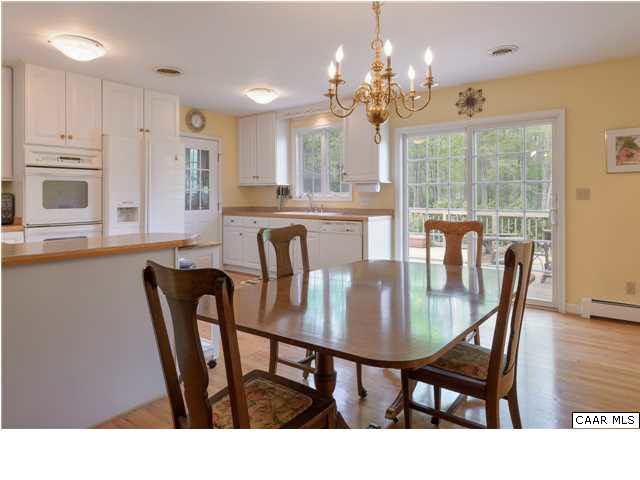 4284 Slam Gate Road Crozet, VA 22932 - Photo 5 of 30 a view of a dining room with furniture window and wooden floor