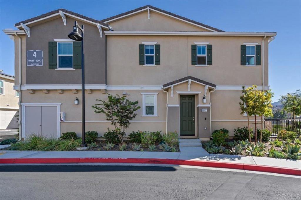 10427 Graphite Street Spring Valley, CA 91977 - Photo 1 of 1 a front view of house with yard and green space