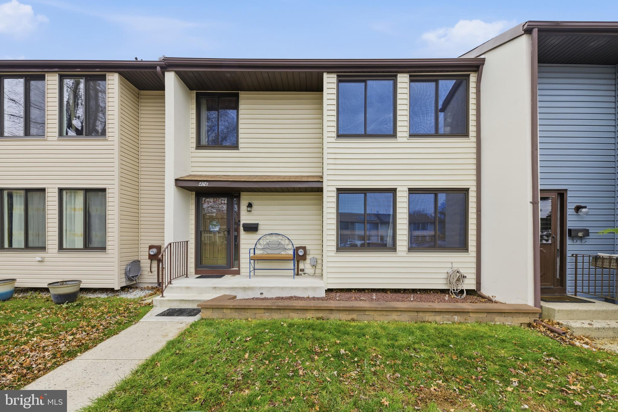 front view of a house with a yard