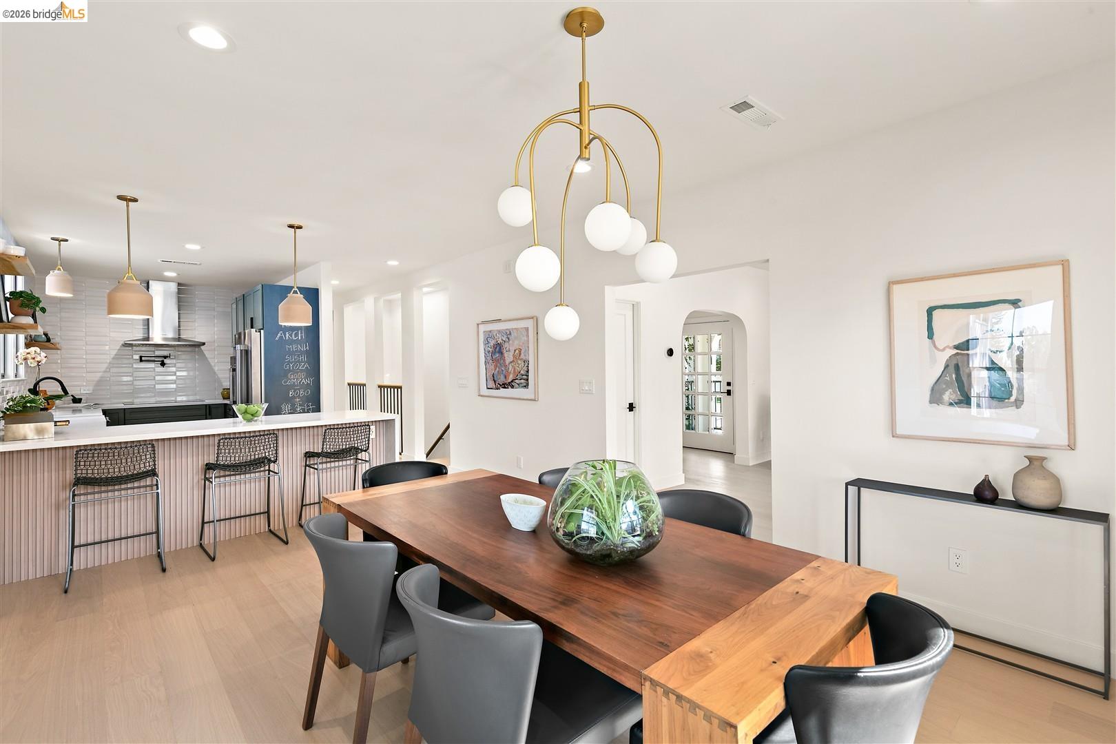 1668 Arch Street Berkeley, CA 94709 - Photo 17 of 78 Open-concept living space with light wood-finish flooring, a contemporary chandelier, and recessed lighting