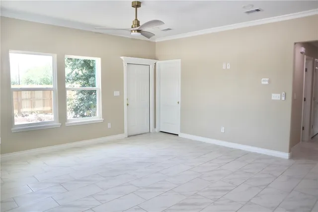 a view of an empty room with a window