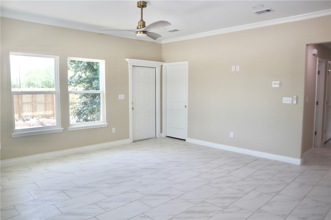 406 Old Robstown Road Corpus Christi, TX 78408 - Photo 2 of 15 a view of an empty room with a window