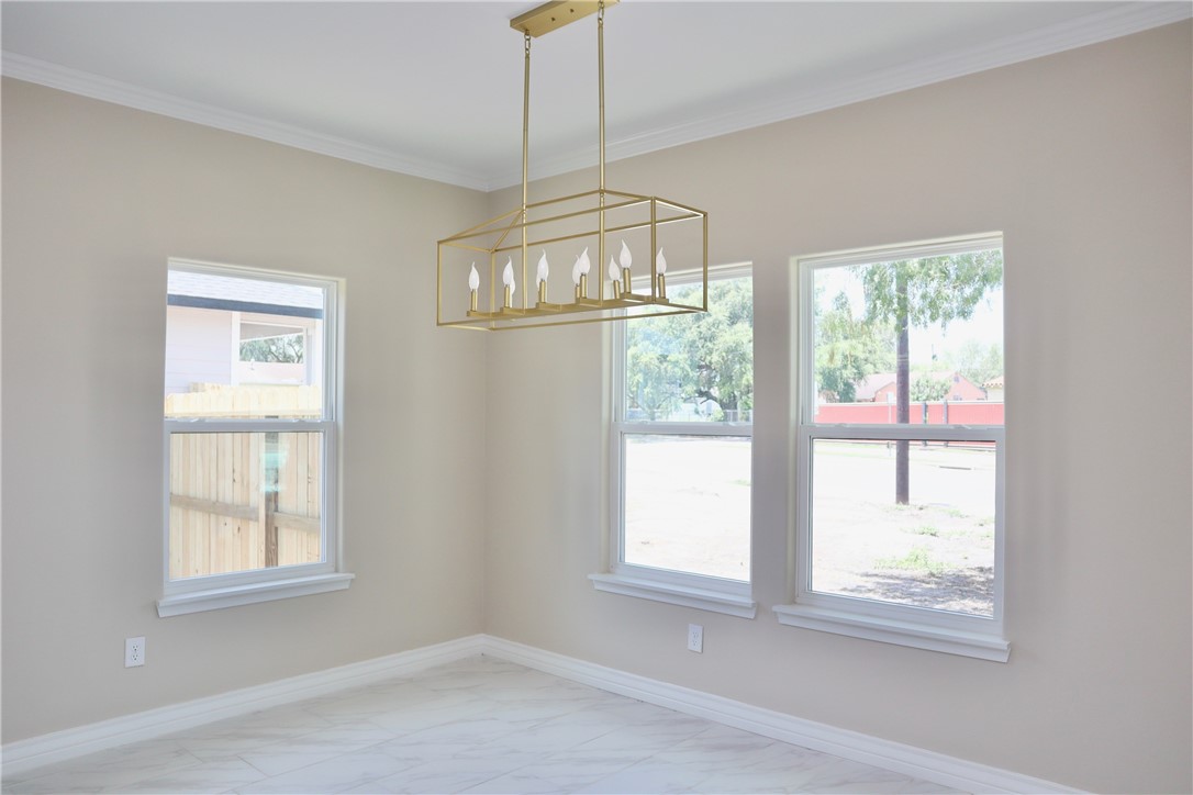 406 Old Robstown Road Corpus Christi, TX 78408 - Photo 6 of 15 a view of an empty room with a window