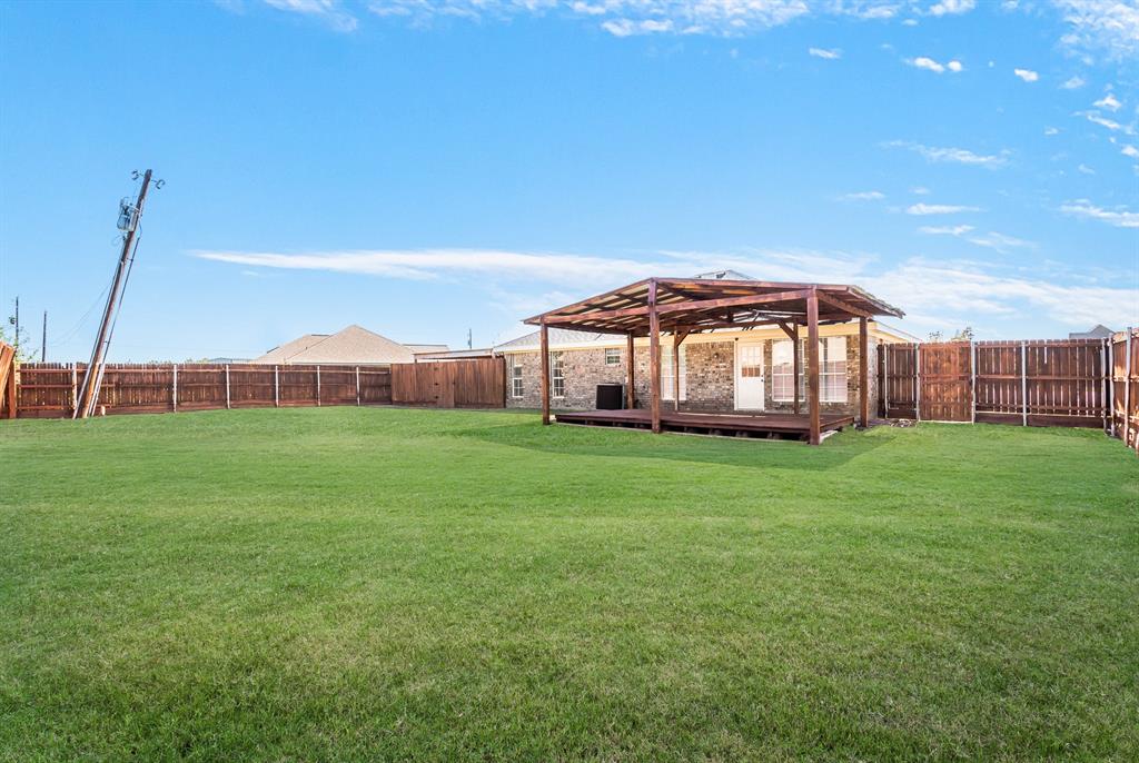 712 Billups Street Van Alstyne, TX 75495 - Photo 37 of 38 a view of a house with a big yard