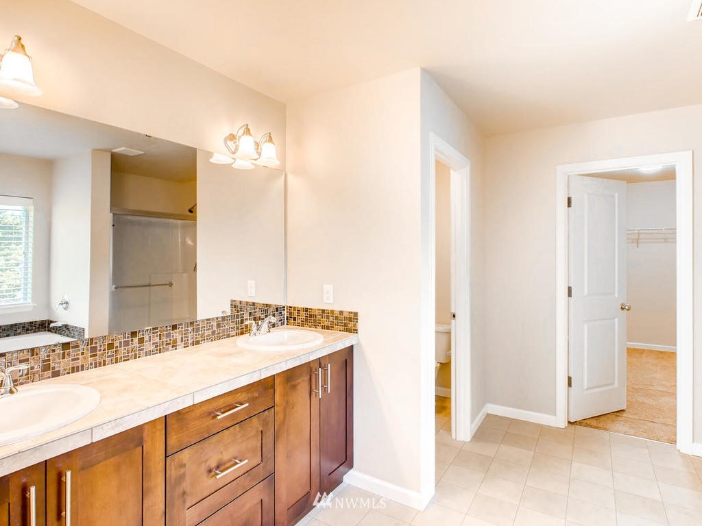 418 South 37th Street Renton, WA 98055 - Photo 17 of 24 a bathroom with a sink and a mirror
