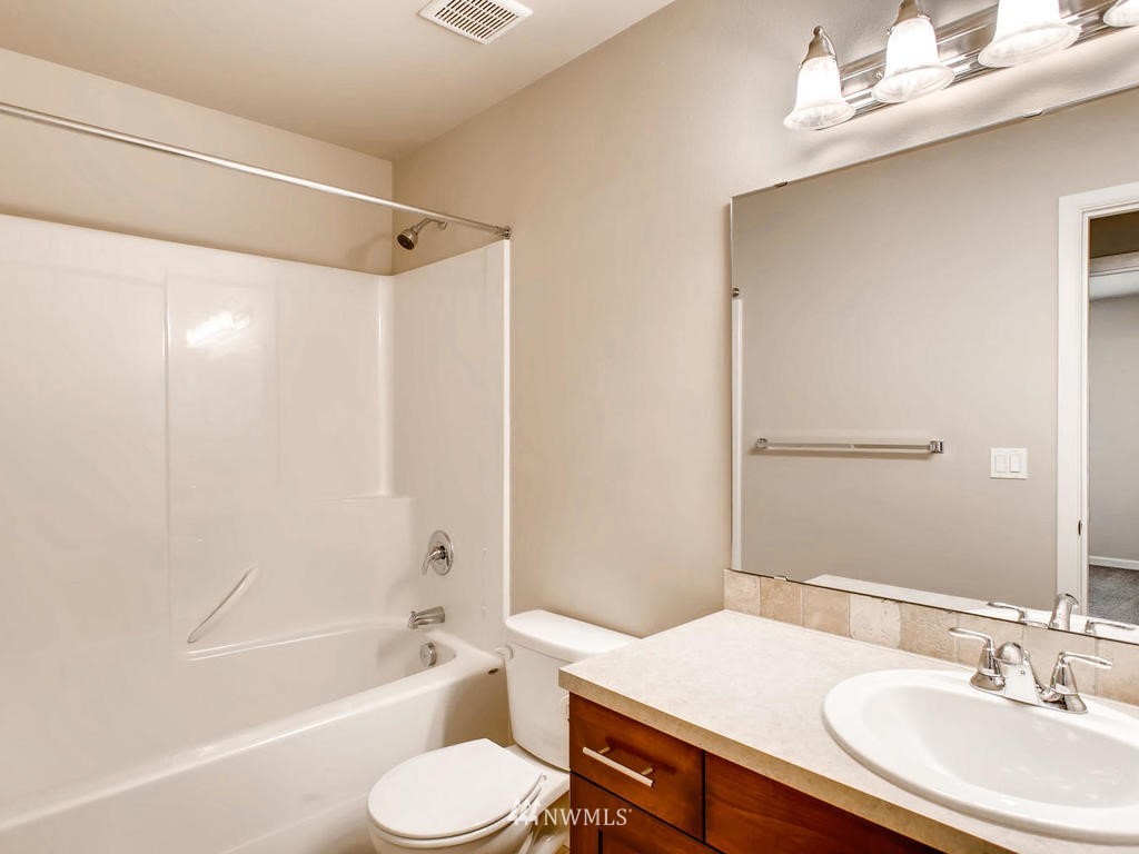 418 South 37th Street Renton, WA 98055 - Photo 20 of 24 a bathroom with a granite countertop sink toilet and shower
