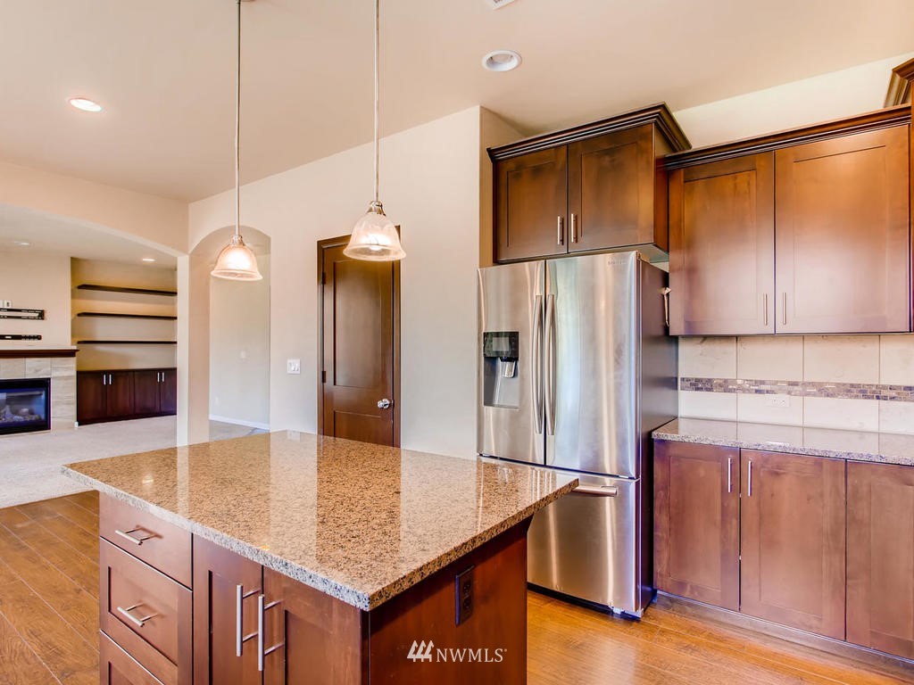 418 South 37th Street Renton, WA 98055 - Photo 10 of 24 a kitchen with stainless steel appliances granite countertop a refrigerator a sink and a stove
