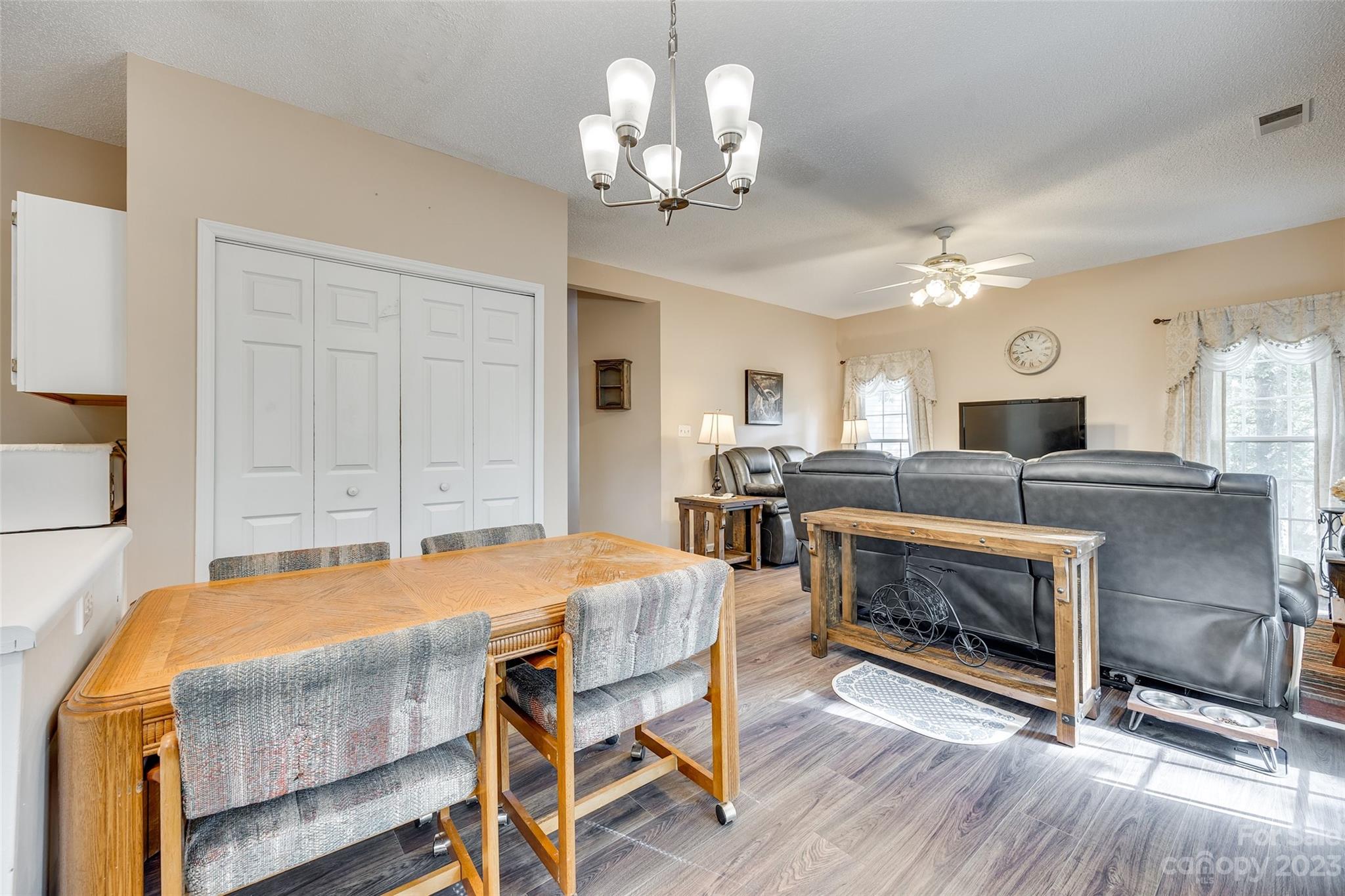 10305 Hatter Ridge Terrace Charlotte, NC 28214 - Photo 12 of 36 a dining room with furniture a fireplace and wooden floor