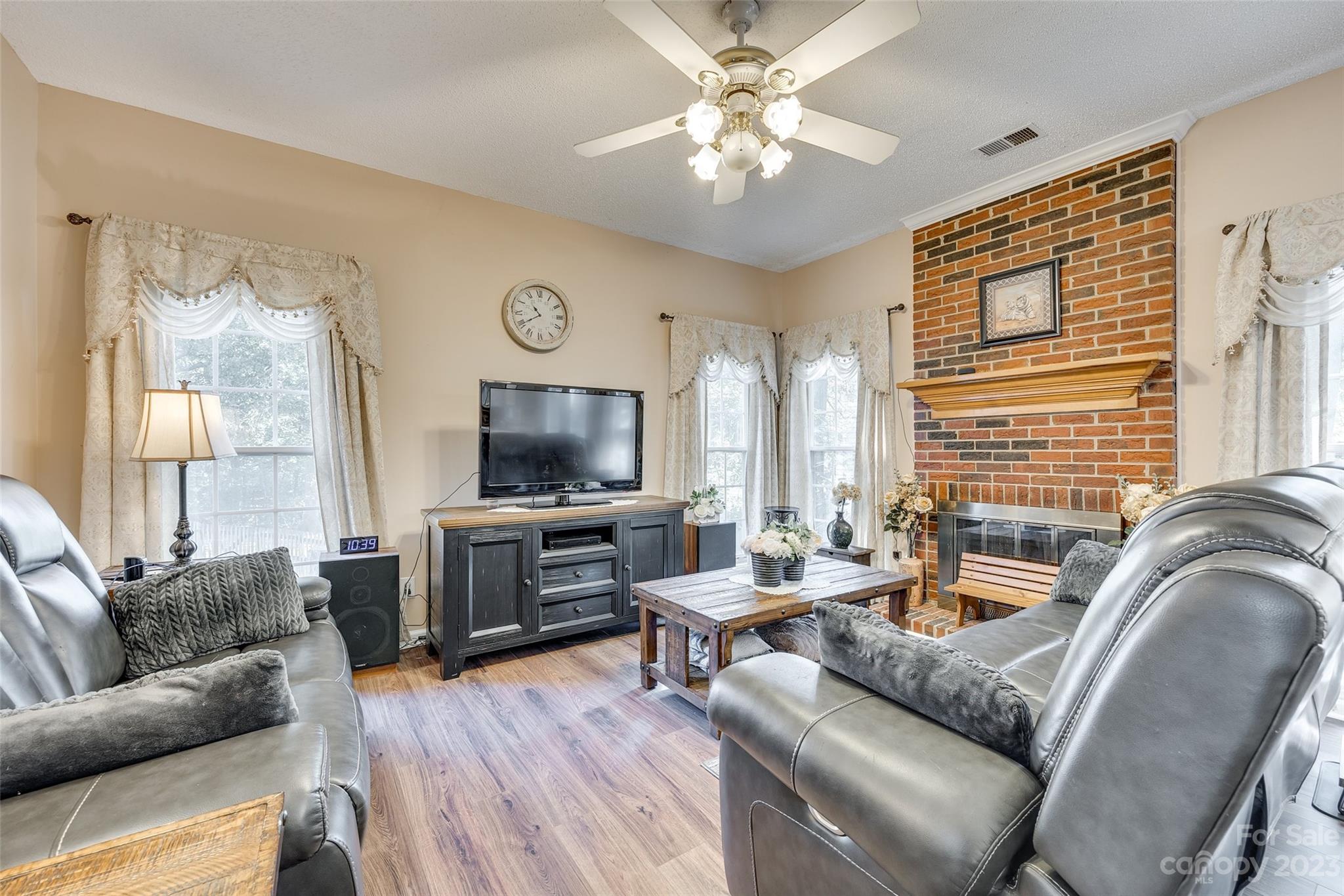 10305 Hatter Ridge Terrace Charlotte, NC 28214 - Photo 14 of 36 a living room with furniture and a flat screen tv