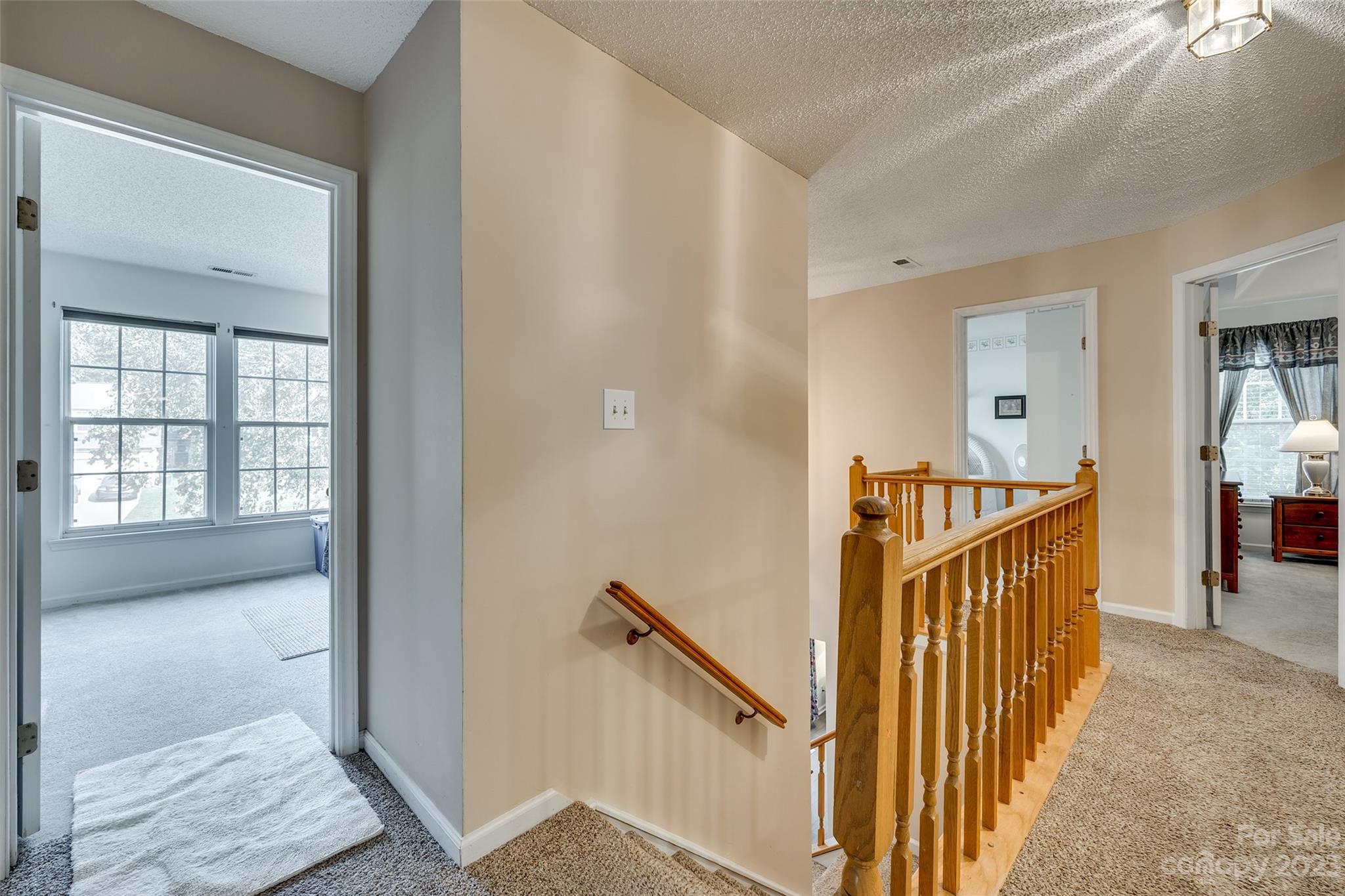 10305 Hatter Ridge Terrace Charlotte, NC 28214 - Photo 18 of 36 a view of a hallway with a window and stairs