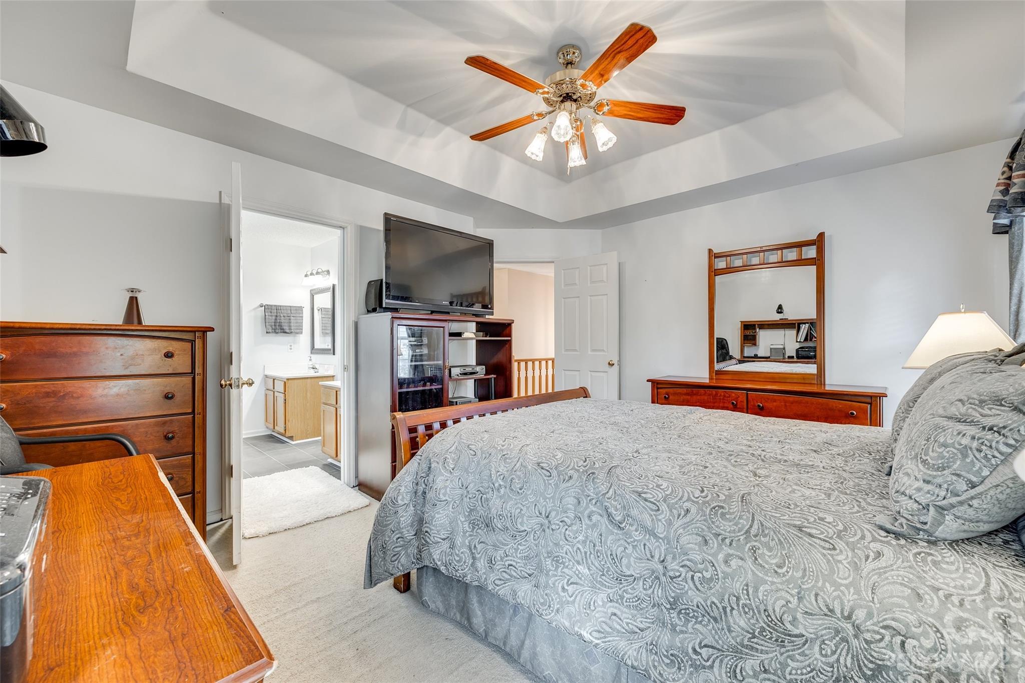 10305 Hatter Ridge Terrace Charlotte, NC 28214 - Photo 20 of 36 a bedroom with a bed and a flat screen tv