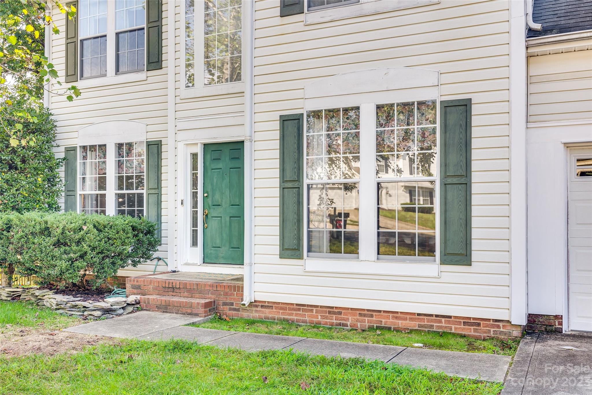 10305 Hatter Ridge Terrace Charlotte, NC 28214 - Photo 2 of 36 a front view of a house with a yard