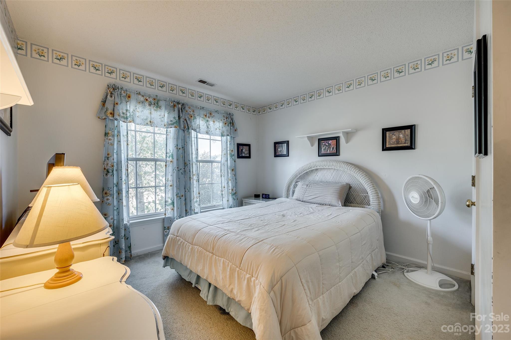 10305 Hatter Ridge Terrace Charlotte, NC 28214 - Photo 24 of 36 a bedroom with a bed and window