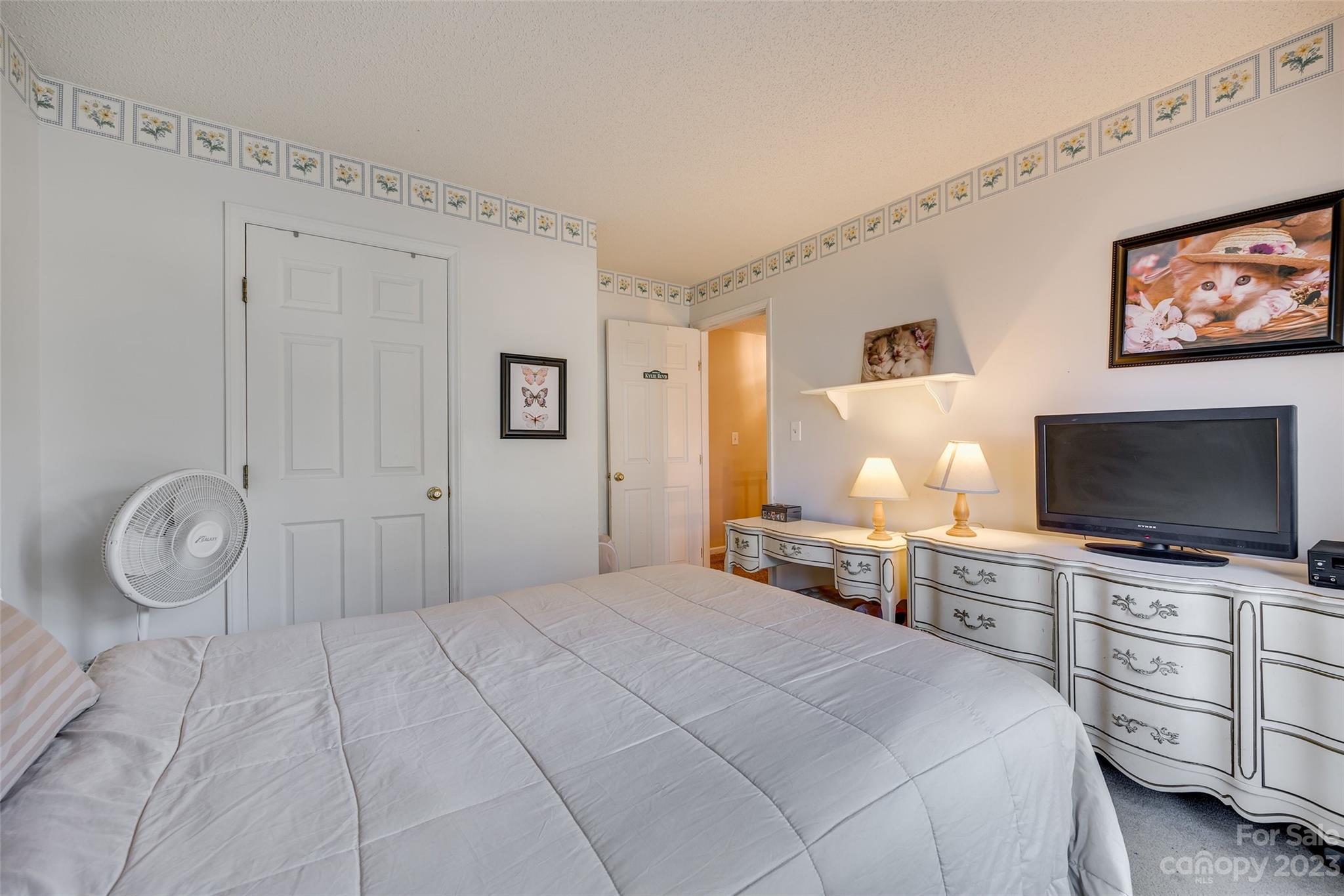 10305 Hatter Ridge Terrace Charlotte, NC 28214 - Photo 25 of 36 a bedroom with furniture and a flat screen tv