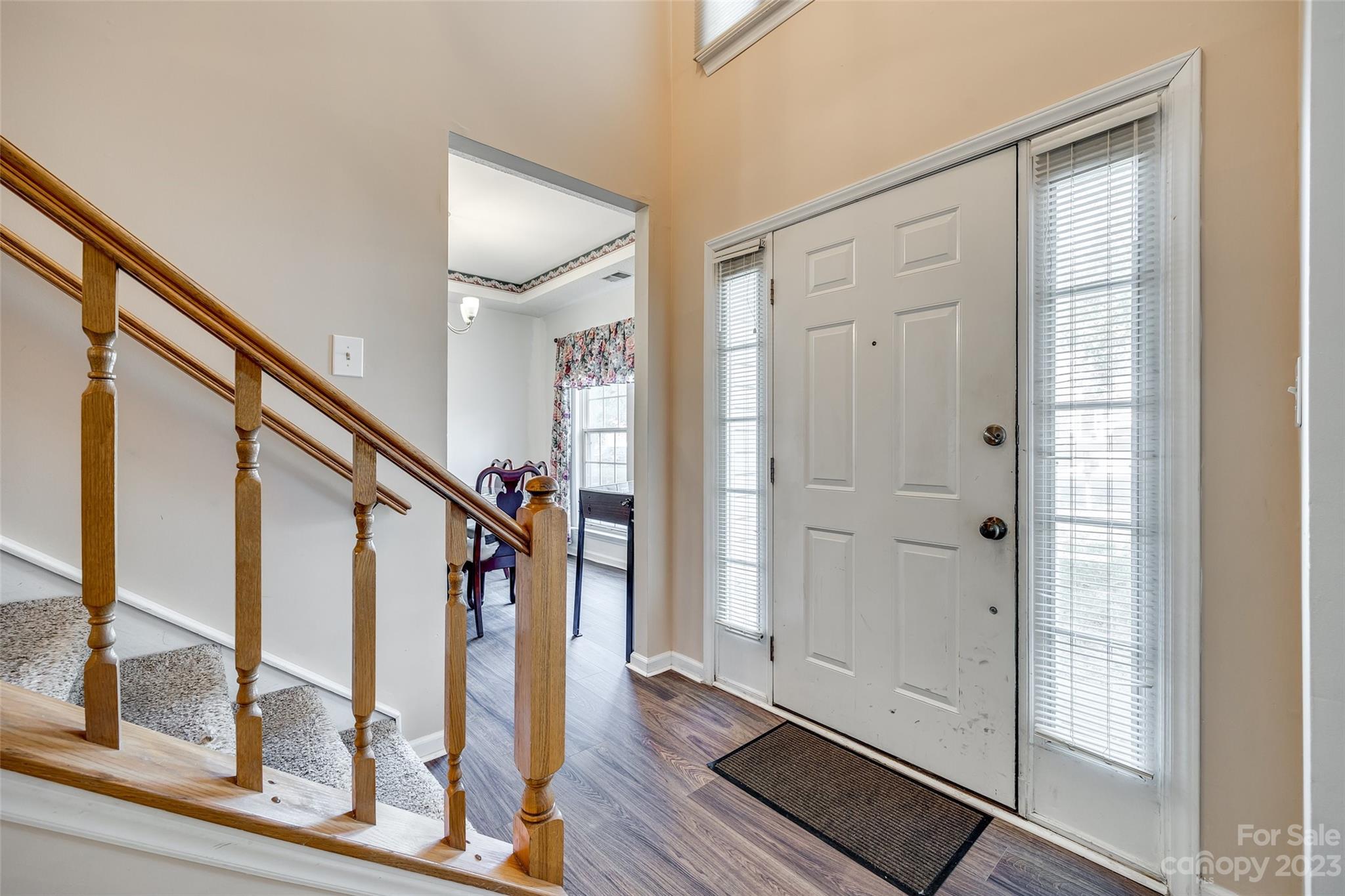 10305 Hatter Ridge Terrace Charlotte, NC 28214 - Photo 3 of 36 a view of front door with wooden floor and stairs