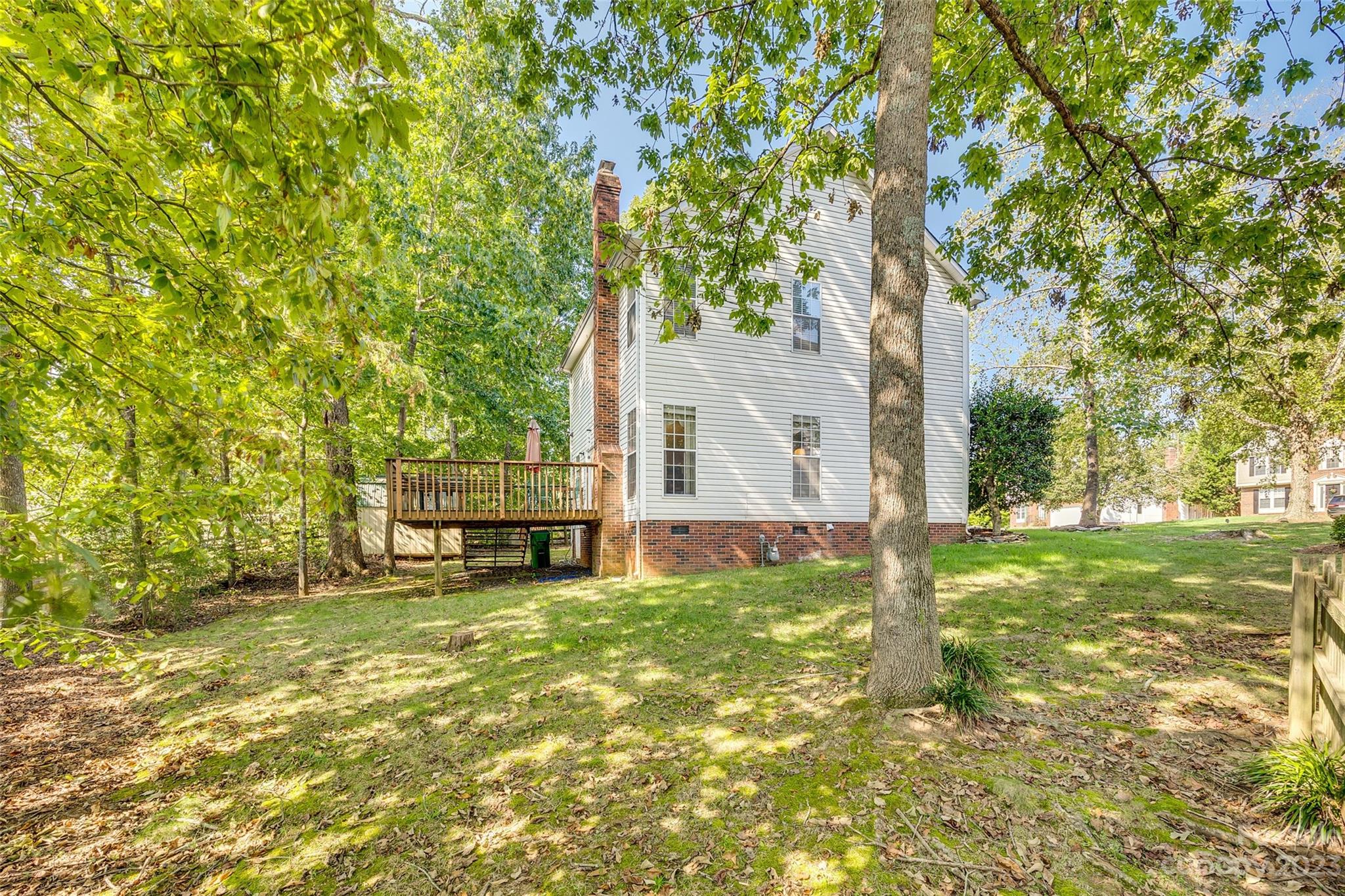 10305 Hatter Ridge Terrace Charlotte, NC 28214 - Photo 33 of 36 a view of a house with a yard