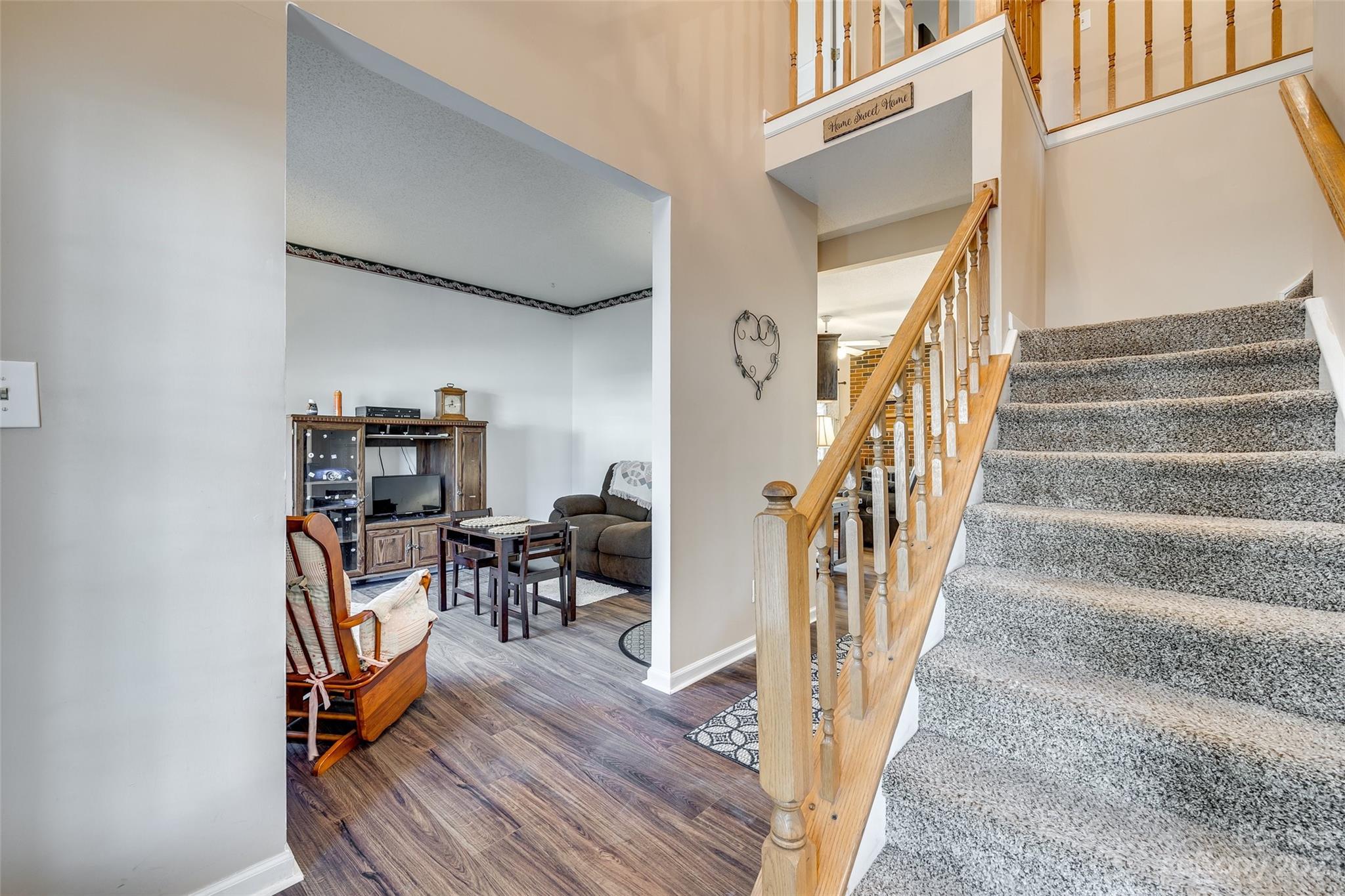 10305 Hatter Ridge Terrace Charlotte, NC 28214 - Photo 4 of 36 a view of entryway with wooden floor and stairs