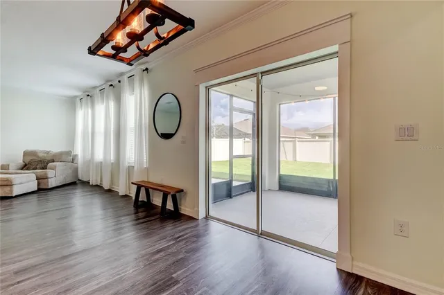 a large kitchen with granite countertop a sink and stainless steel appliances