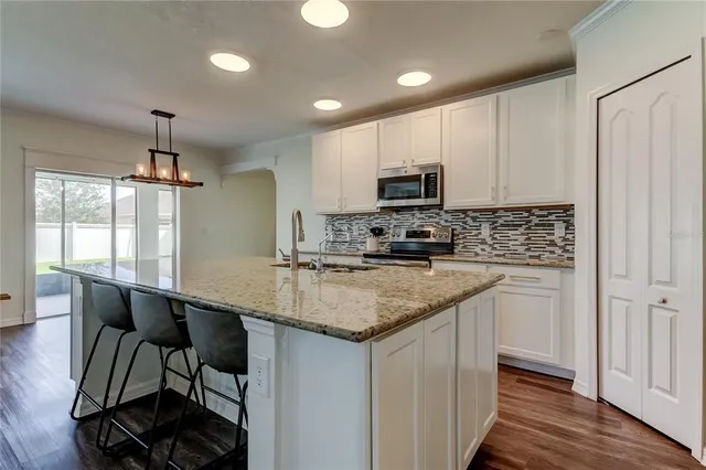 a room with a mirror and a wooden floor