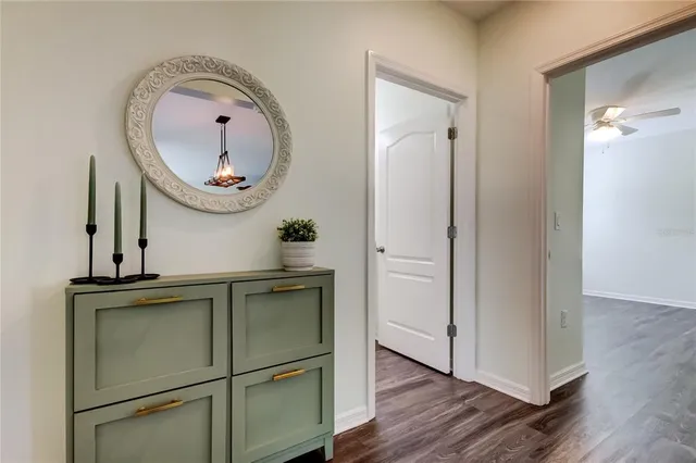 a view of a hallway with a window and stairs