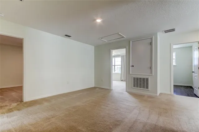 a bathroom with a granite countertop sink vanity and mirror