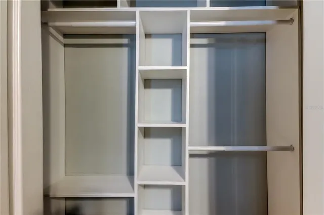 a bathroom with a sink vanity and mirror