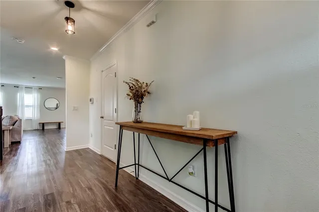 a view of a workspace with furniture and wooden floor