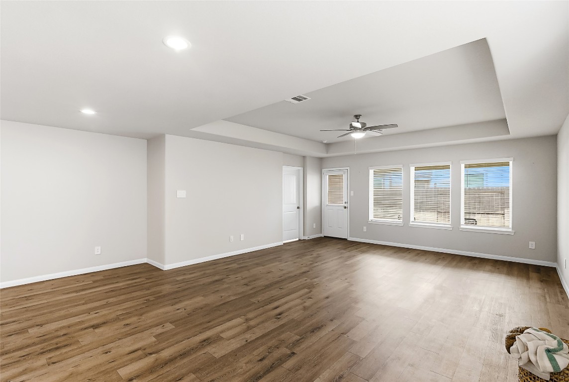 995 Rice Drive Bryan, TX 77803 - Photo 12 of 23 a view of an empty room with wooden floor and a window