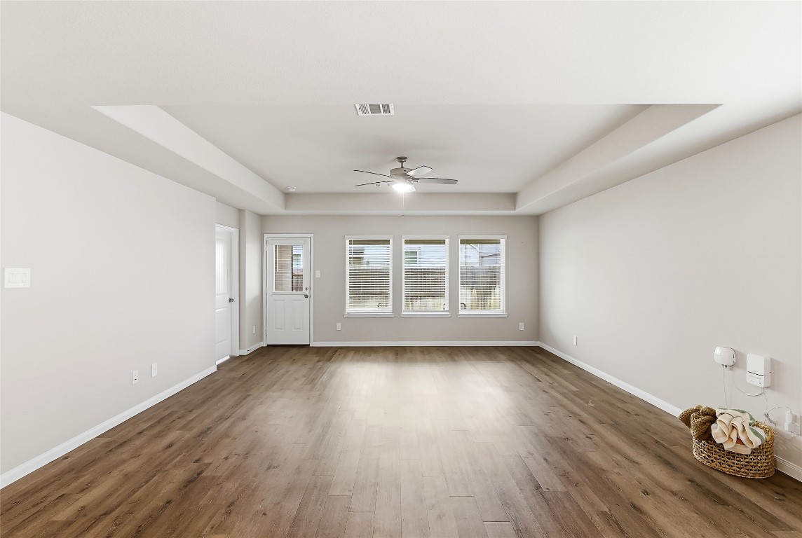 995 Rice Drive Bryan, TX 77803 - Photo 13 of 23 wooden floor in an empty room with a window