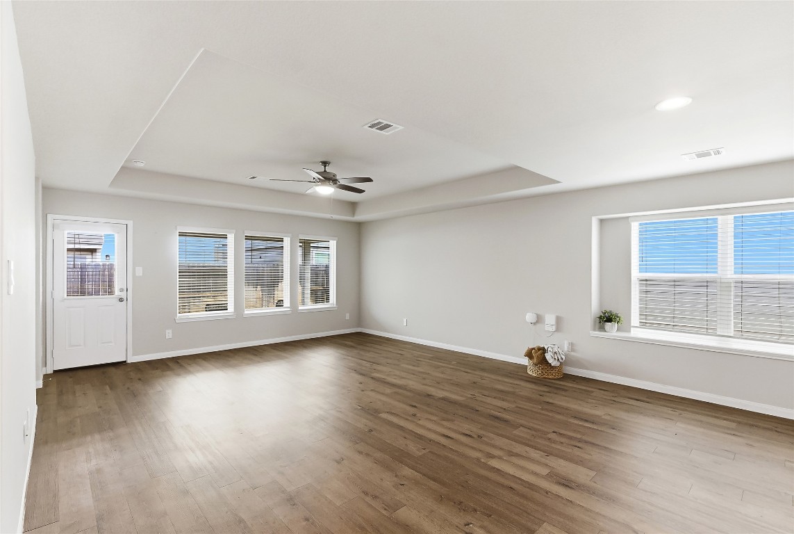 995 Rice Drive Bryan, TX 77803 - Photo 14 of 23 an empty room with wooden floor and windows