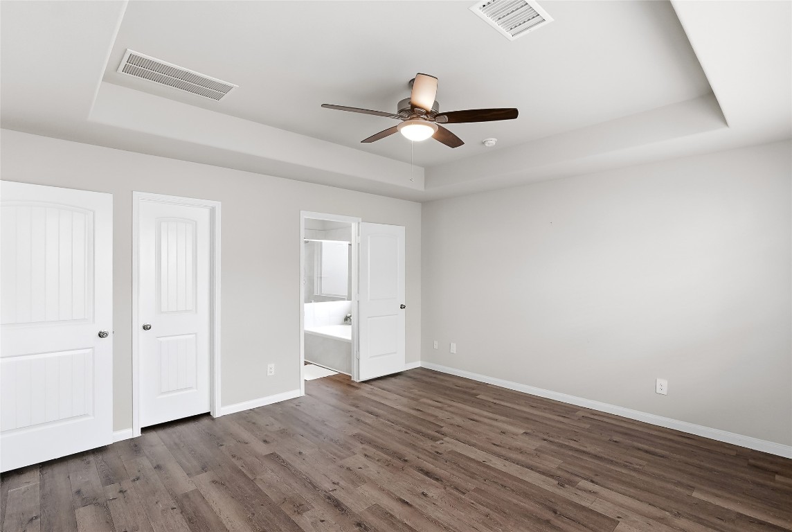 995 Rice Drive Bryan, TX 77803 - Photo 17 of 23 an empty room with wooden floor and windows