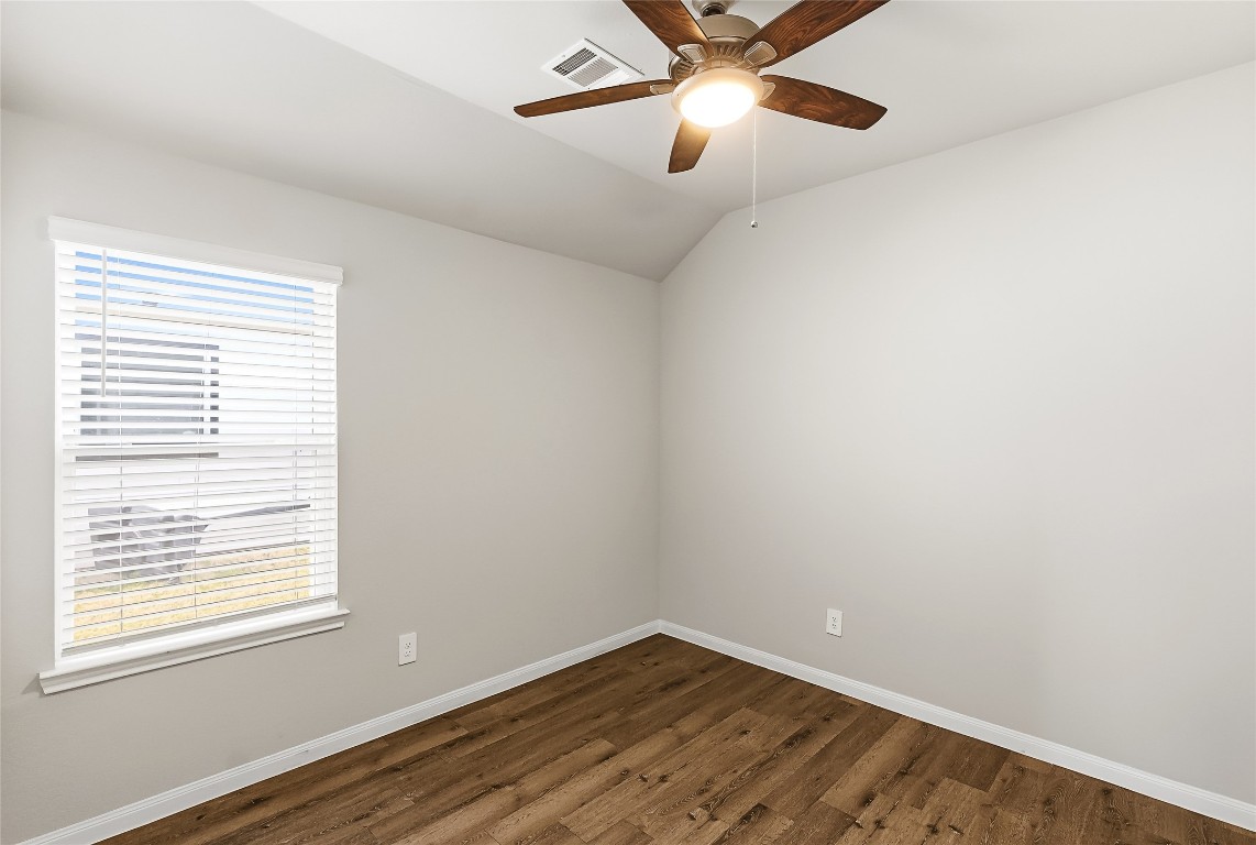 995 Rice Drive Bryan, TX 77803 - Photo 19 of 23 an empty room with a window and a fan