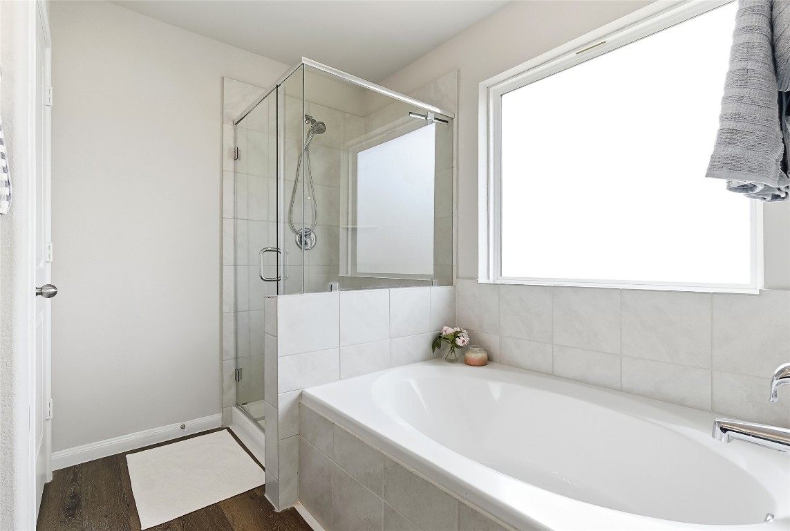 995 Rice Drive Bryan, TX 77803 - Photo 21 of 23 a bathroom with a bathtub and a shower