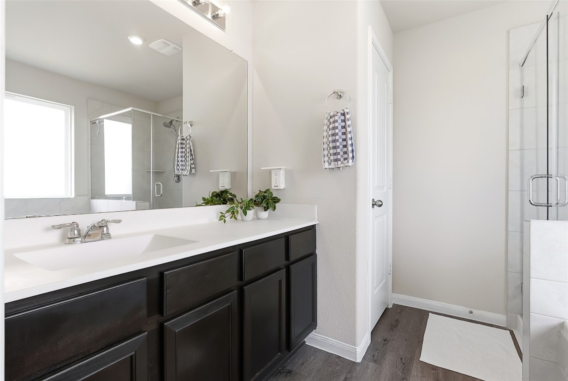 995 Rice Drive Bryan, TX 77803 - Photo 22 of 23 a bathroom with a sink and a mirror