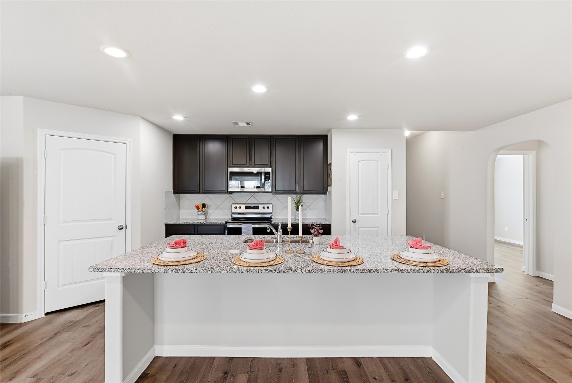 995 Rice Drive Bryan, TX 77803 - Photo 8 of 23 a view of kitchen with microwave and cabinets