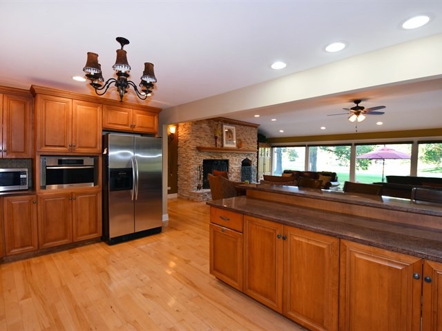 575 Aberdeen Road Frankfort, IL 60423 - Photo 15 of 25 a large kitchen with stainless steel appliances a large counter top a stove and a refrigerator