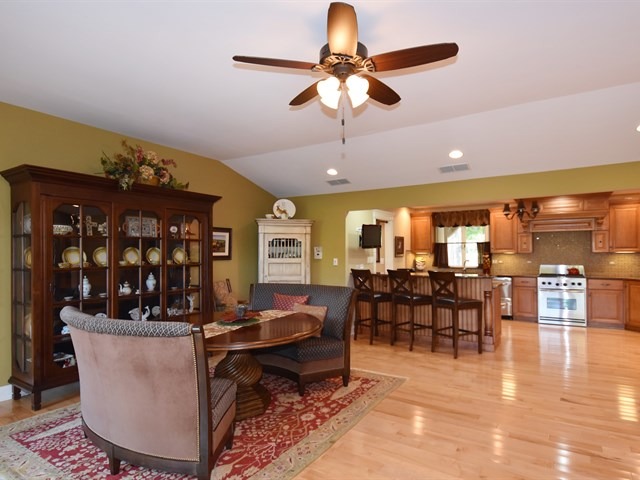 575 Aberdeen Road Frankfort, IL 60423 - Photo 9 of 25 a living room with furniture a dining table and kitchen view