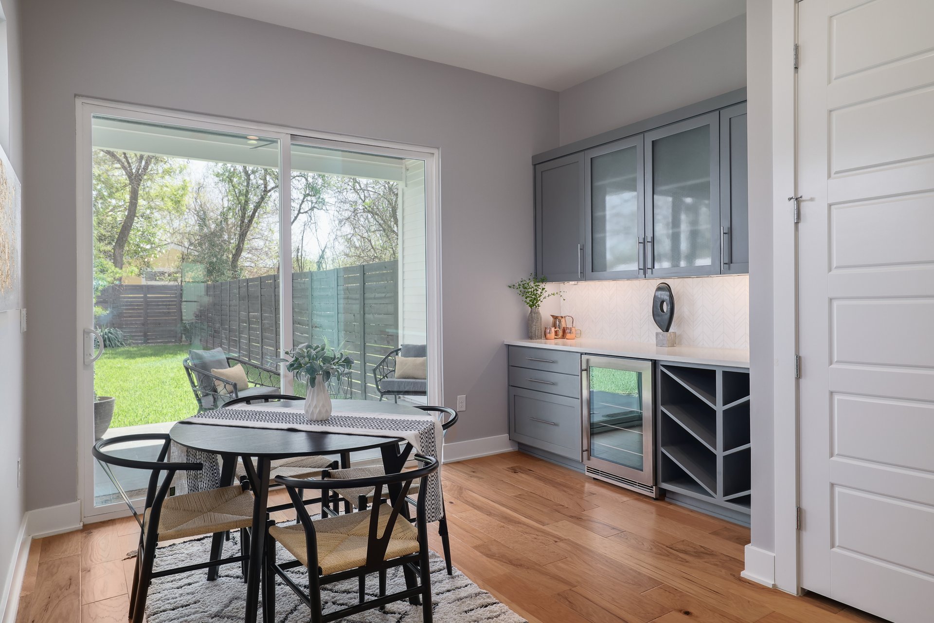 1103 Saucedo Street, Unit 2 Austin, TX 78721 - Photo 11 of 26 Positioned perfectly for hosting, the dedicated wine bar features a built-in beverage fridge and extra counter space right next to the dining area