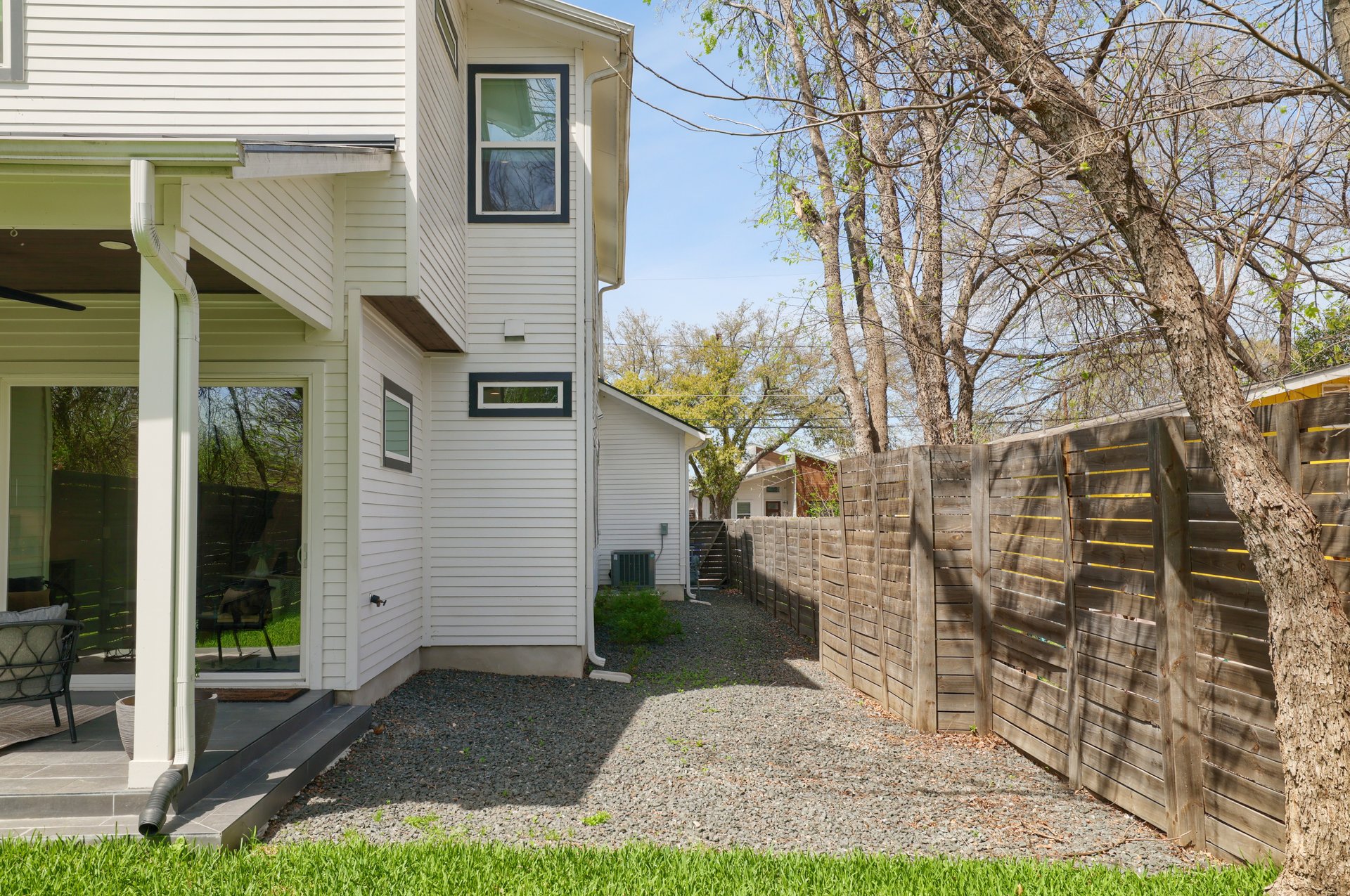 1103 Saucedo Street, Unit 2 Austin, TX 78721 - Photo 24 of 26 A dedicated xeriscape section on the side of the property is a natural fit for a fire pit and Adirondack chairs, perfect for cool Austin evenings