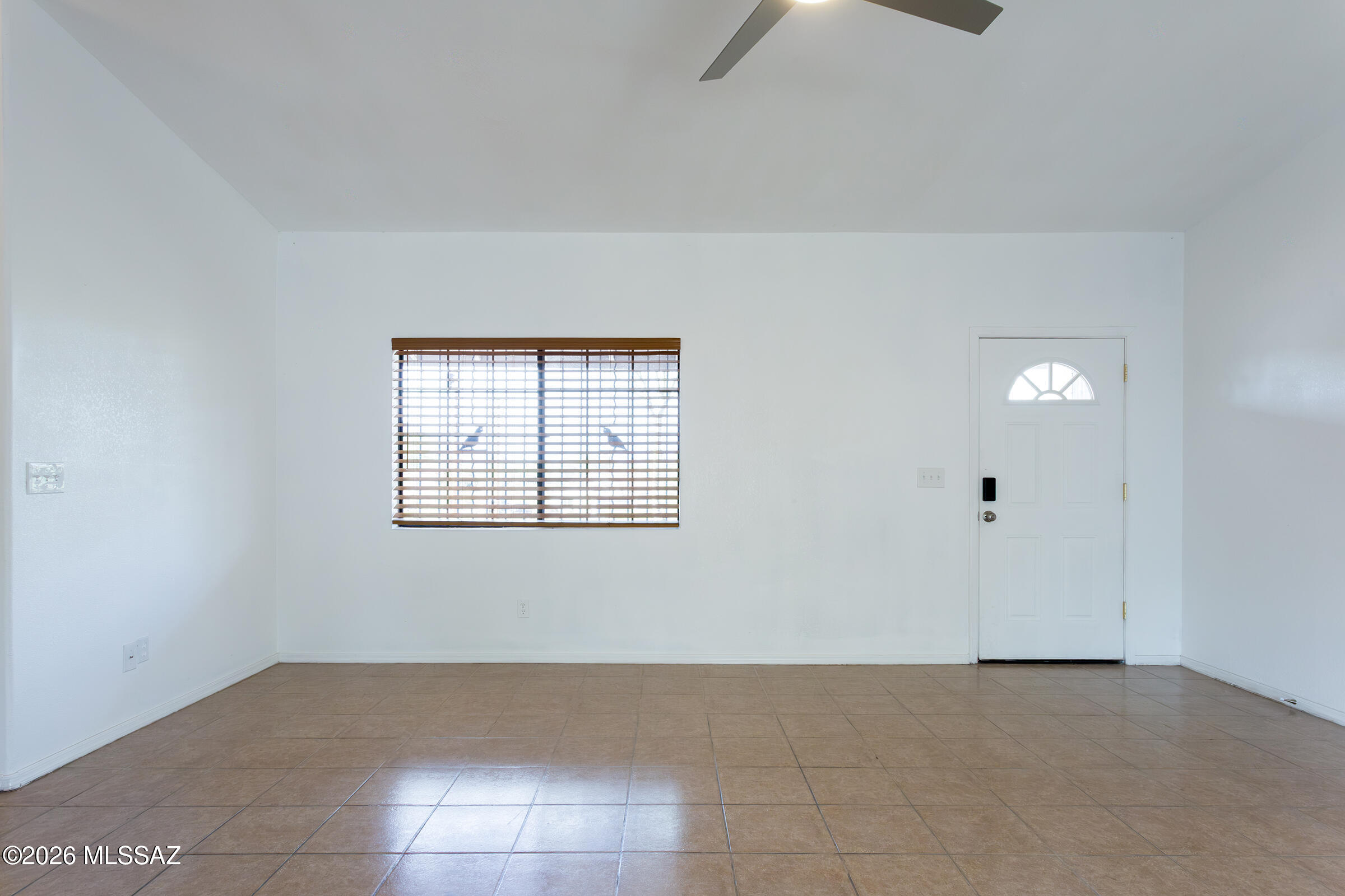 1081 Paseo Freno Rio Rico, AZ 85648 - Photo 3 of 46 a view of an empty room with a window