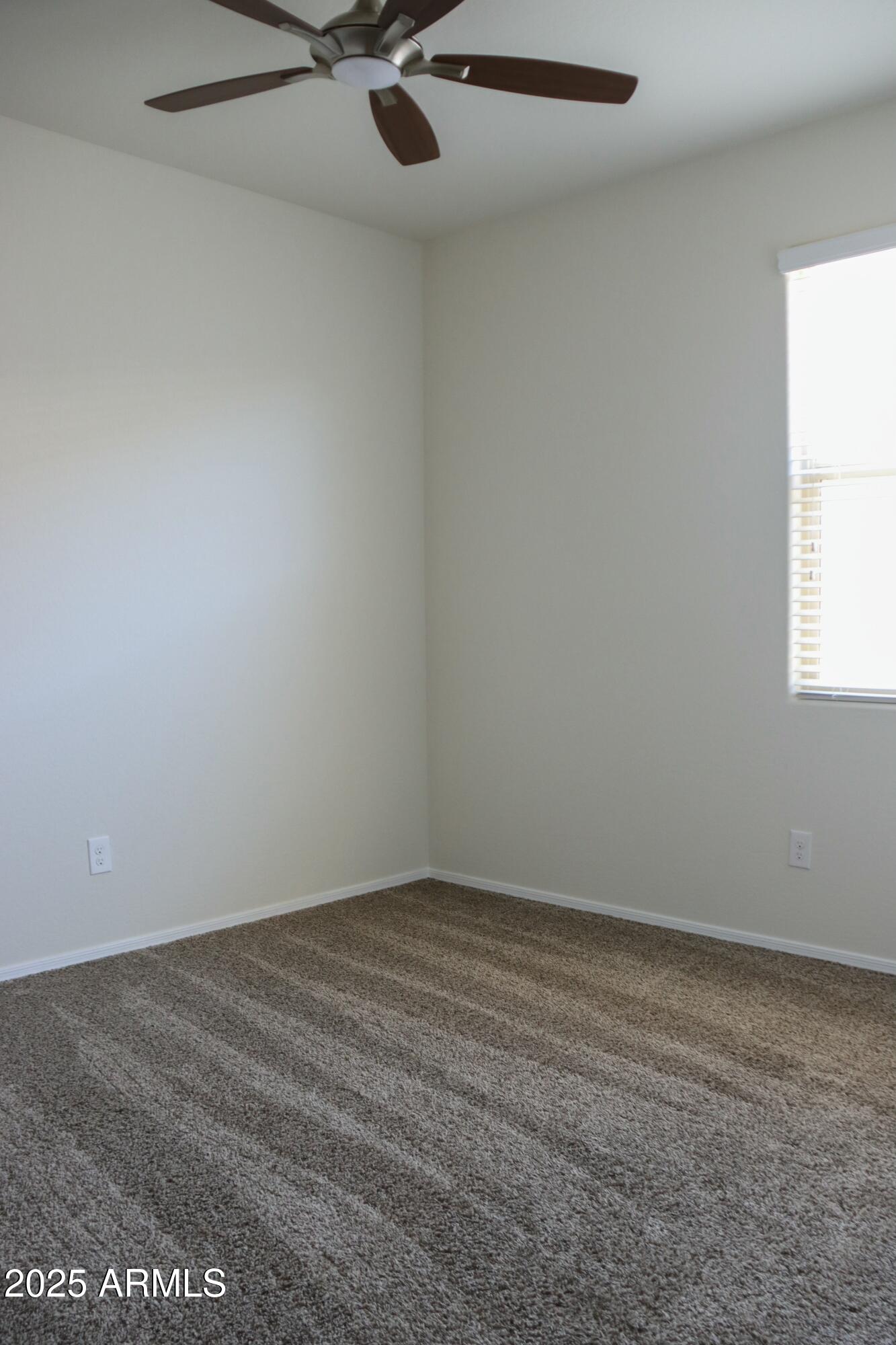 4734 East Pearl Road San Tan Valley, AZ 85143 - Photo 11 of 27 an empty room with a window